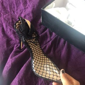Black fishnet pouted toe heels